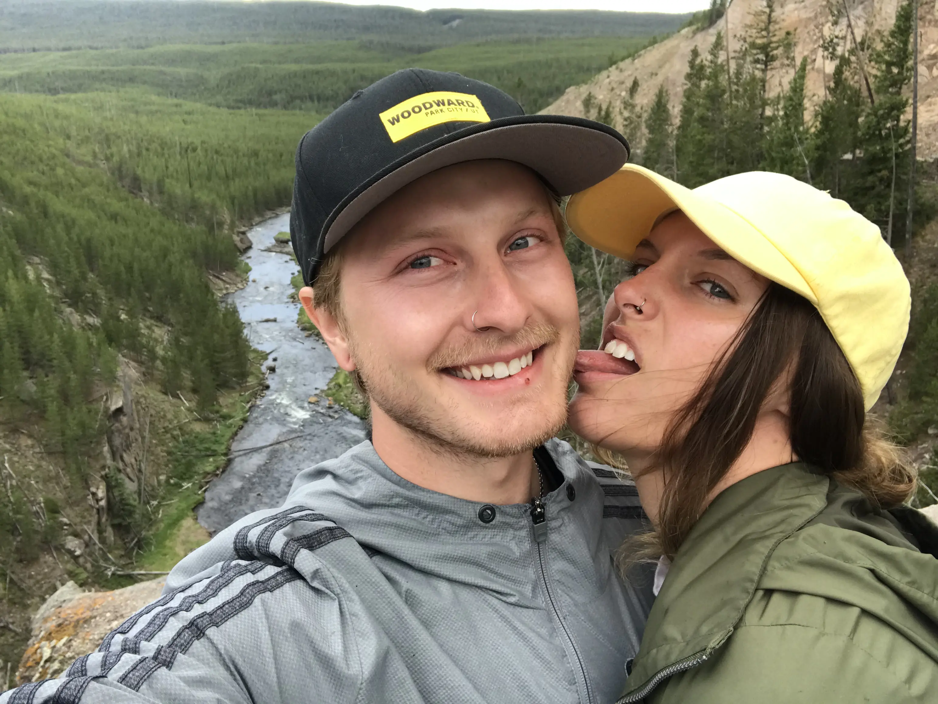 Drew and Emma taking a selfie next to the waterfall